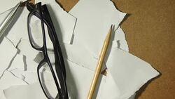 Scrap paper and pencil, pen, glasses Stock Footage