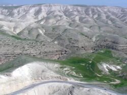  WS AERIAL ZI PAN View of desert  mountain / Qumran,  Norrn Judea Desert, Israel Stock Footage