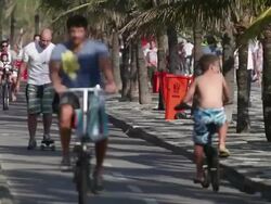 MS Passers by walking at cycle path at Arpoador Beach / Rio de Janeiro, Brazil Stock Footage