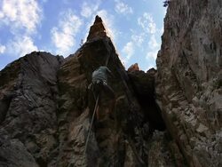 Static blurred shot of a rock-climber hanging from a rope. Stock Footage
