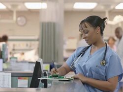 Female Doctor filling out forms Stock Footage