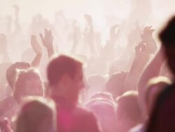 crowd of young people covered in colored powder and celebrating Stock Footage