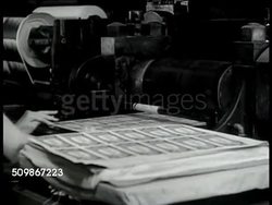 1947: U.S. TREASURY: CU Sheets of paper money out of printing press. CU Feeding sheets into roller. EXT MS Treasury Department. INT MS Corridor, people walking. VS Women sitting in office at desks w/ tabulating machines. Washington D.C. Instructional Video