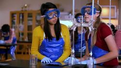 Students share tablets to conduct chemistry lab experiment Stock Footage