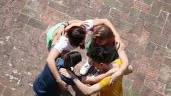Teenagers embracing together - Cooperation Stock Footage