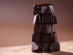 Melt chocolate pouring into pieces chocolate Stock Footage