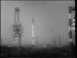 B/W 1961 long shot tilt up Mercury 4 rocket blasting off from launch pad / Gus Grissom Stock Footage