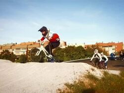 HD SLOW MOTION: Racers Racing On Bmx Track Stock Footage