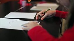 Little girl using a ruler and a pencil. Stock Footage