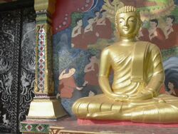 Golden Buddha figure at Wat Klong Prao buddhist temple Stock Footage