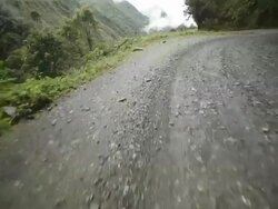 A road winds around a narrow canyon in Bolivia. Stock Footage