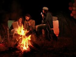 Three young women using laptop in the forest, Delhi, India Stock Footage
