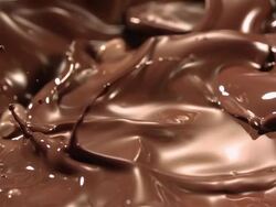 orange slices falling into melted chocolate Stock Footage