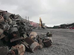 Scrap and metal garbage at the old harbor of the abandoned Russian settlement and coal mining community Pyramiden on the archipelago of Svalbard, Norway Stock Footage
