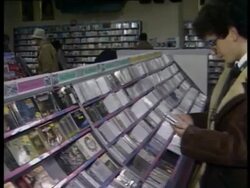 INT Music Store - people shopping for CDs Stock Footage