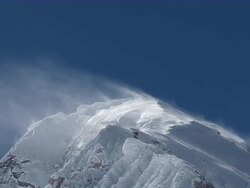 MS Snow blowing with wind on snow covered peak of mount everest with blue sky / Mt. Everest, Nepal Stock Footage