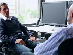 CU R/F Two businesswomen in discussion in office/Washington, USA Stock Footage