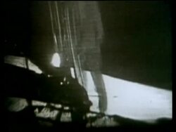 Apollo 11 astronaut Neil Armstrong, stepping off ladder onto lunar surface, first man on the moon Stock Footage