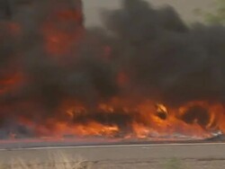CU burning cars and truck in  crash, lots of black smoke, caused by sandstorm, USA. Stock Footage