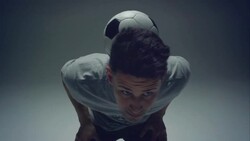 young male soccer freestyler juggles a ball on his neck Stock Footage