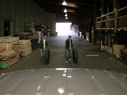 WS Two young men working together in lumberyard with truck / Minneapolis, Minnesota, United States Stock Footage