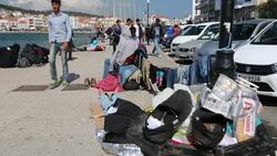 Syrian migrants fleeing the war and escaping to Europe, who have landed on the Greek island of Lesvos on the north coast at Efthalou and made their way to Mytilini. Up to 4,000 migrants a day are landing on the island and overwhelming the authorities. They Stock Footage