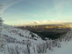 Panoramic view of valley from ski hill summit in winter Stock Footage