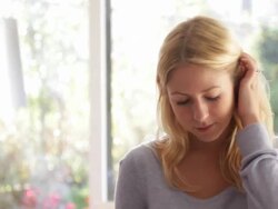 Female in kitchen drinking coffee Stock Footage