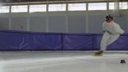 MS SLO MO Short track speed skaters racing on ice track in arena Stock Footage