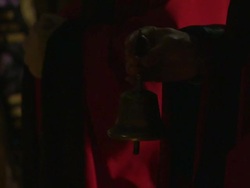 A priest gently rings a small bell during a ceremony in the Bai Yun Guan Temple, Beijing. Stock Footage
