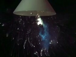SLOMO MCU light bulb under shade exploding Stock Footage
