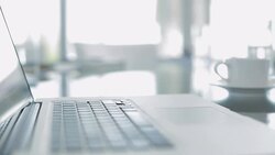 Close up of laptop, coffee cup and notebooks Stock Footage