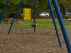 MS SLO MO shot of three Caucasian male children on park swings / Stanford, Connecticut, United States Stock Footage