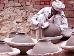 Potter Shaping a Pot at his Home Stock Footage