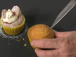 Close-up Woman's Hands Cutting Centre from Cupcake Stock Footage