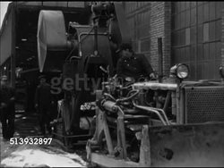1944: SCRAP METAL: VS Various metal parts in scrap yard, factory workers moving metals & machine parts, gears, in factory. World War II, WWII, war effort, steel, production, home front Instructional Video