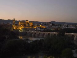 WS ZI night to Cathedral-Mosque, Roman Bridge in foreground Stock Footage