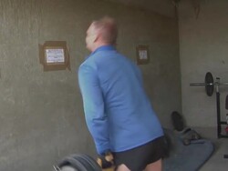 MS Man exercising with weights, one sitting in background / Musa Qala, Helmand Province, Afghanistan. Stock Footage