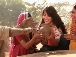 Potter giving pot to three young women in a village, Haryana, India Stock Footage