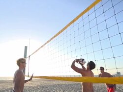 Men playing beach volleyball. - Slow Motion - filmed at 240 fps Stock Footage