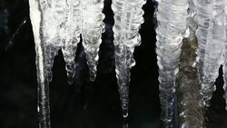 Icicles on a stream in the Lake District, UK Stock Footage