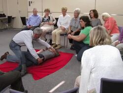 HD: Adult Student Practicing CPR Recovery Position Stock Footage