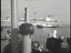 Jewish refugees wave from the deck of an ocean liner in the New York Harbor. News Clip