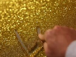 hand writing'logo' on golden sand background Stock Footage