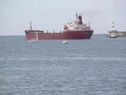 cargo ship leaving the harbor Stock Footage