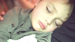 sleeping in elder sister's arms Stock Footage