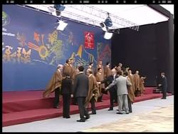 Leaders dress in ponchos for traditional family photo Instructional Video