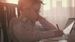 Cute boy making his homework Stock Footage