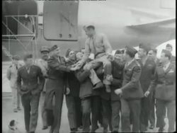 Marines congratulate Major Gregory Pappy Boyington after his release from a Japanese prison camp during World War II. News Clip