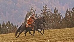 SLO MO TS Cowboy and cowgirl riding their galloping horses Stock Footage
